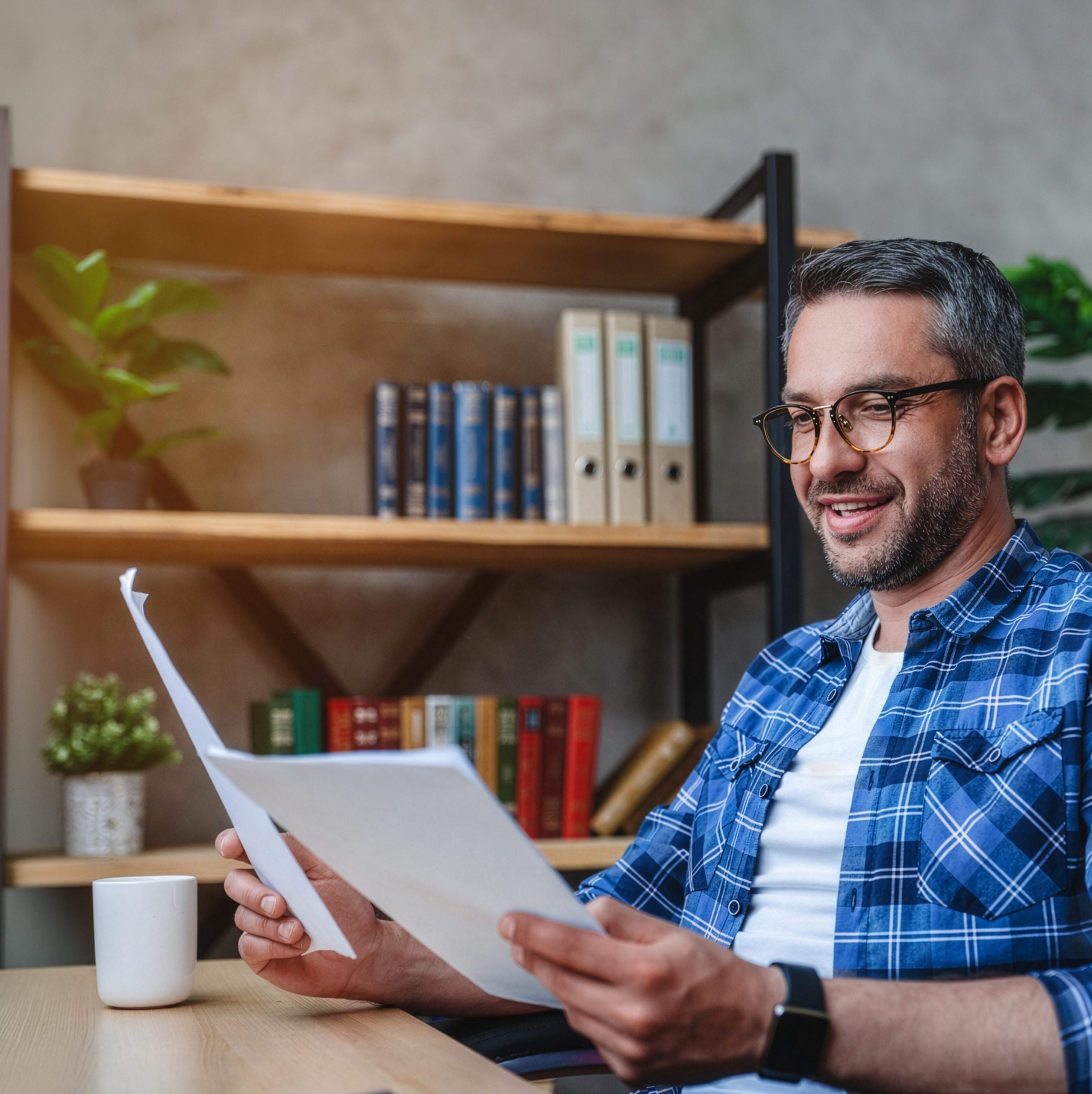 Man Holding Free Resources Hero