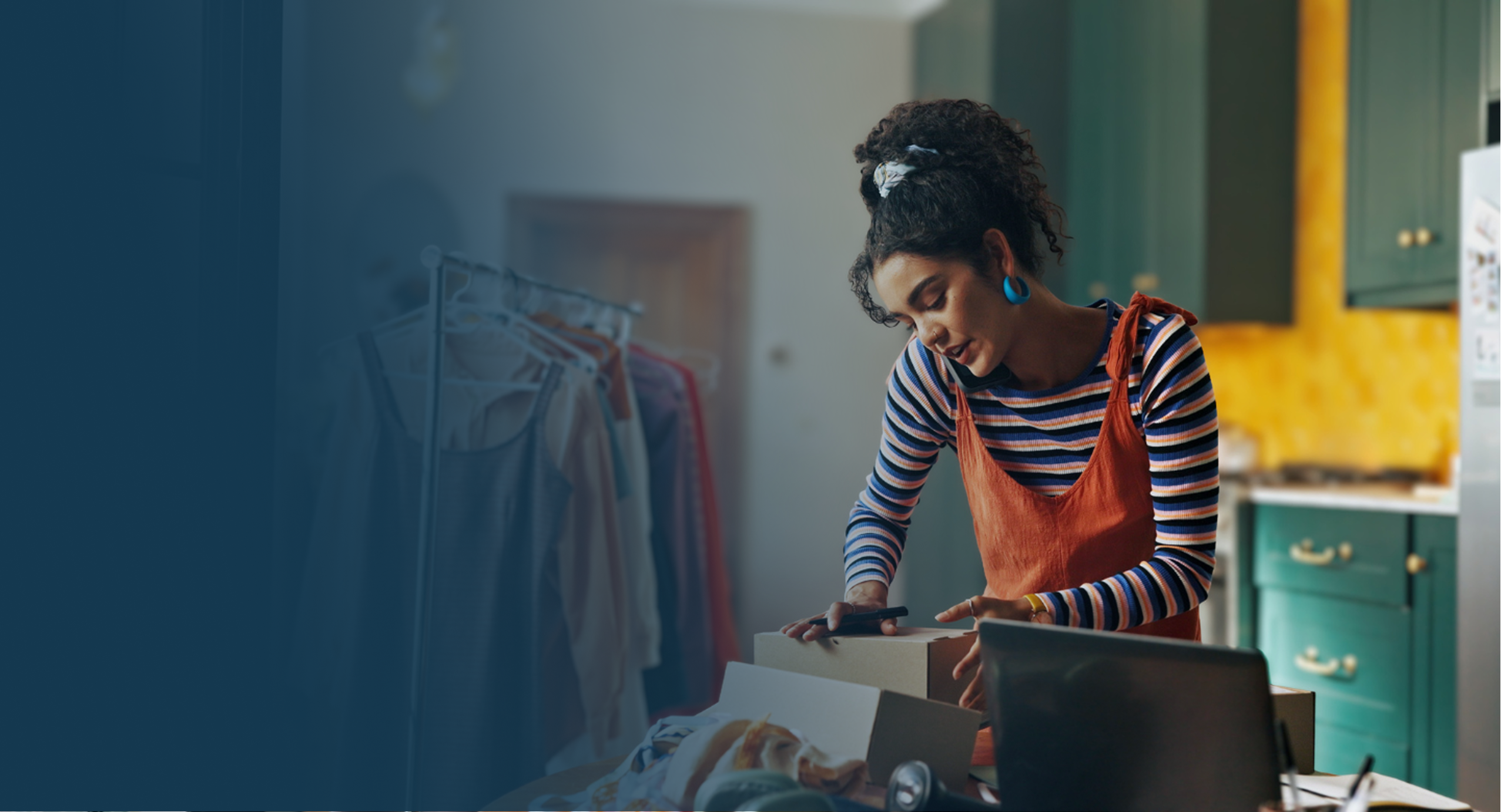 Woman on phone sorting through box of things